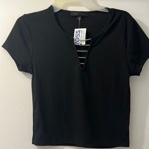 Faded Rose brand black shirt with gems in front. Size medium in women
